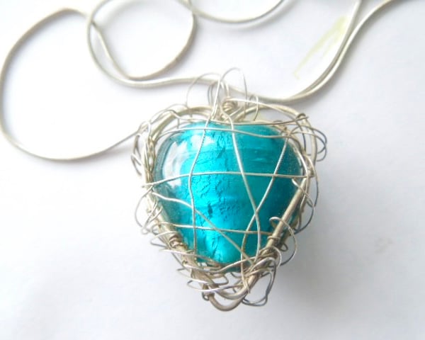 Murano glass turquoise green heart pendant with sterling silver.