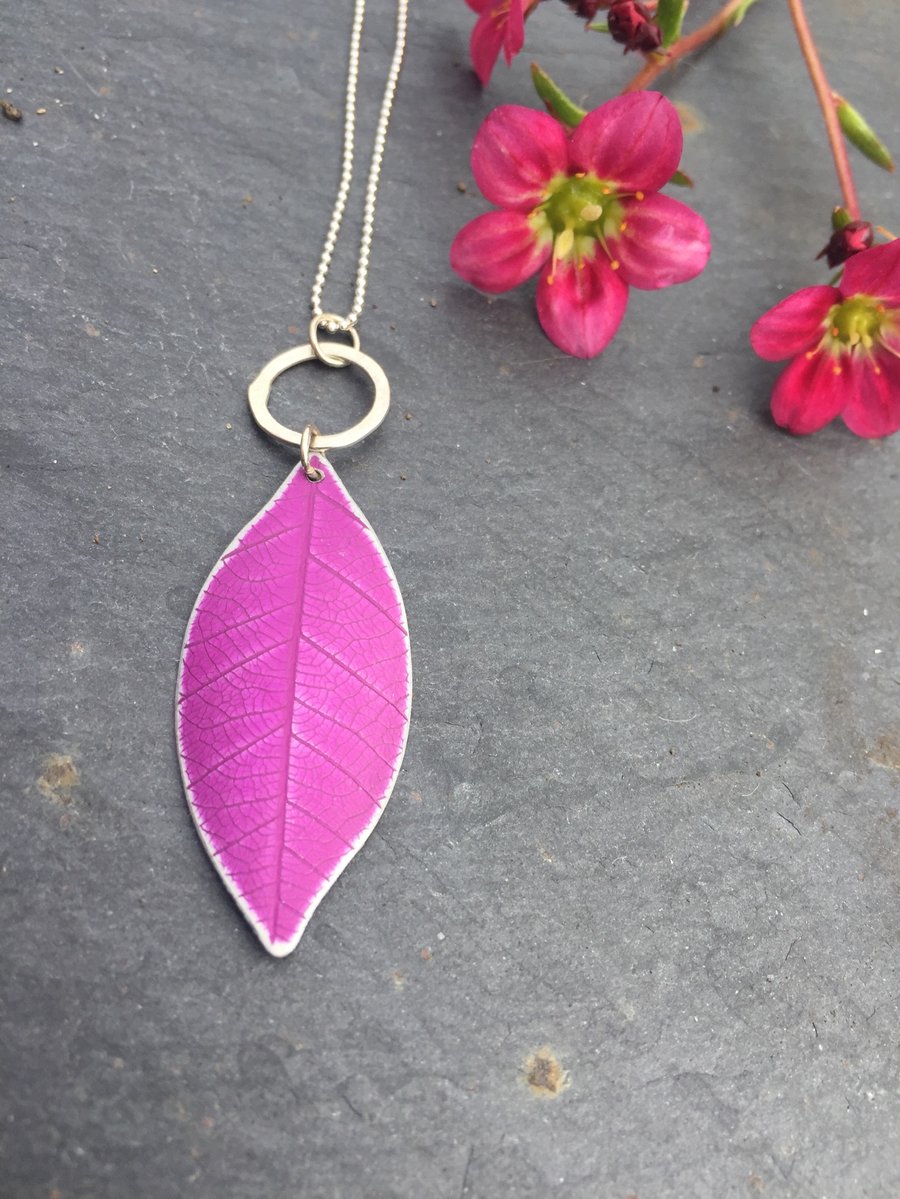 Deep pink anodised aluminium distressed leaf pendant with silver ring