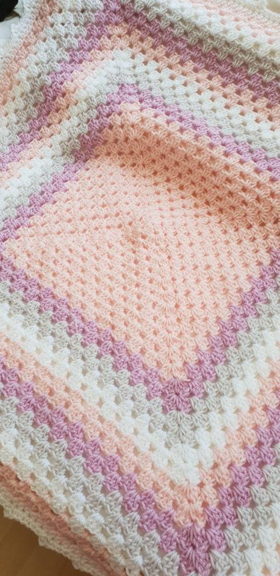 Handmade pink, purple, grey and white granny square baby blanket