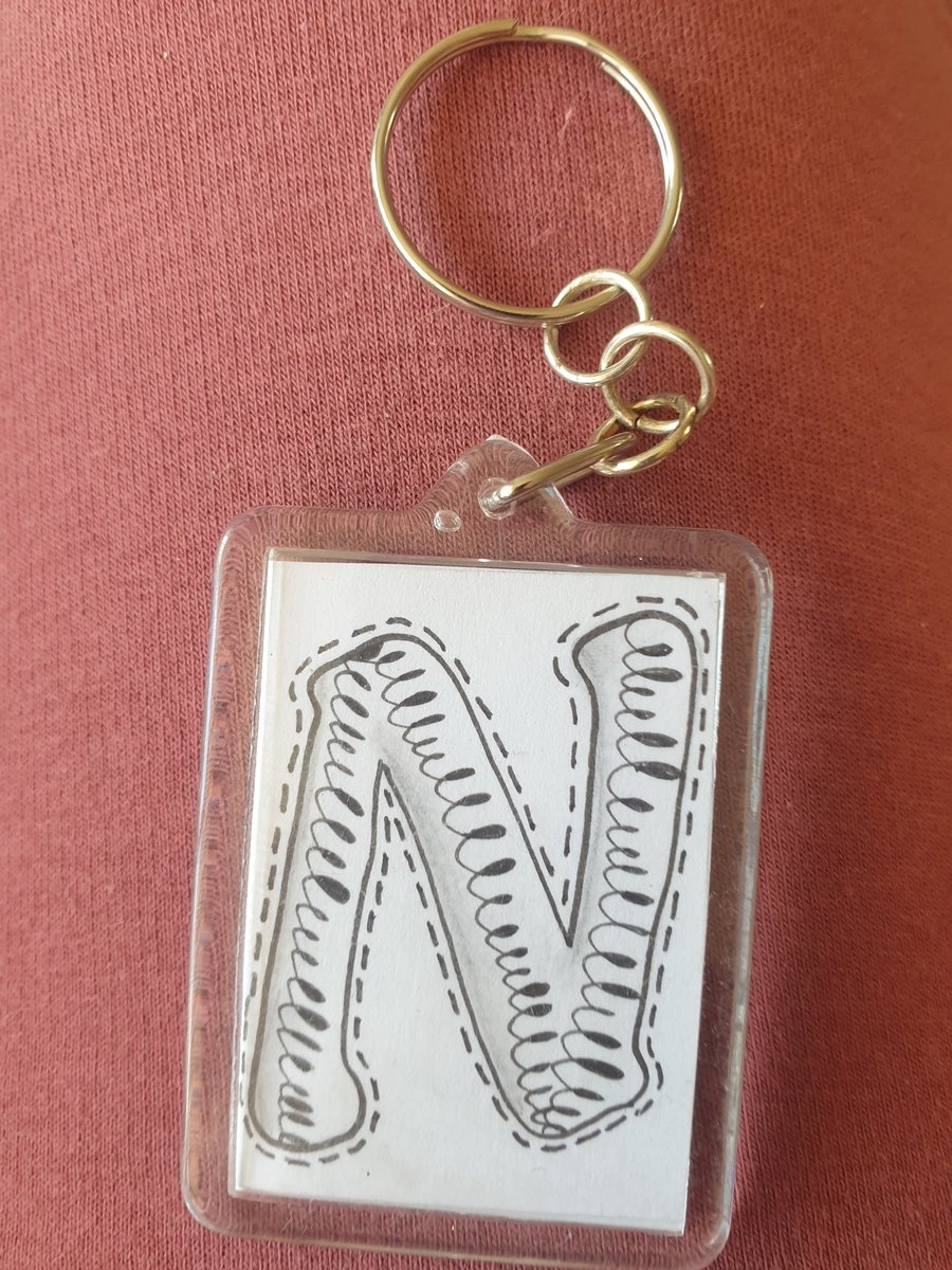 Hand drawn initial "N" keyring.