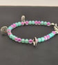 Kids glass beaded shell charm bracelet with sea green and plum beads  - Image 3