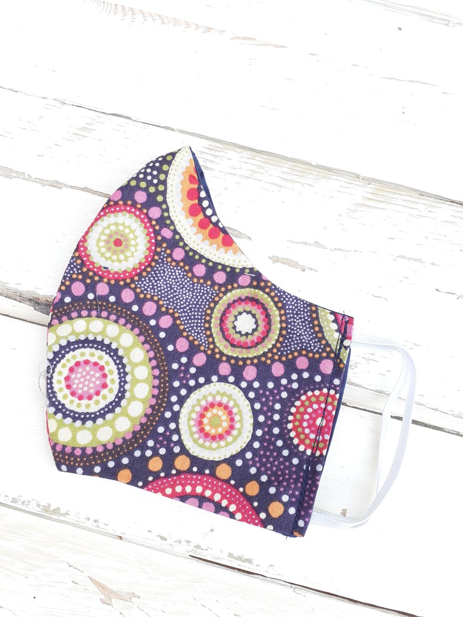 Handmade facemask in multi coloured fabric.