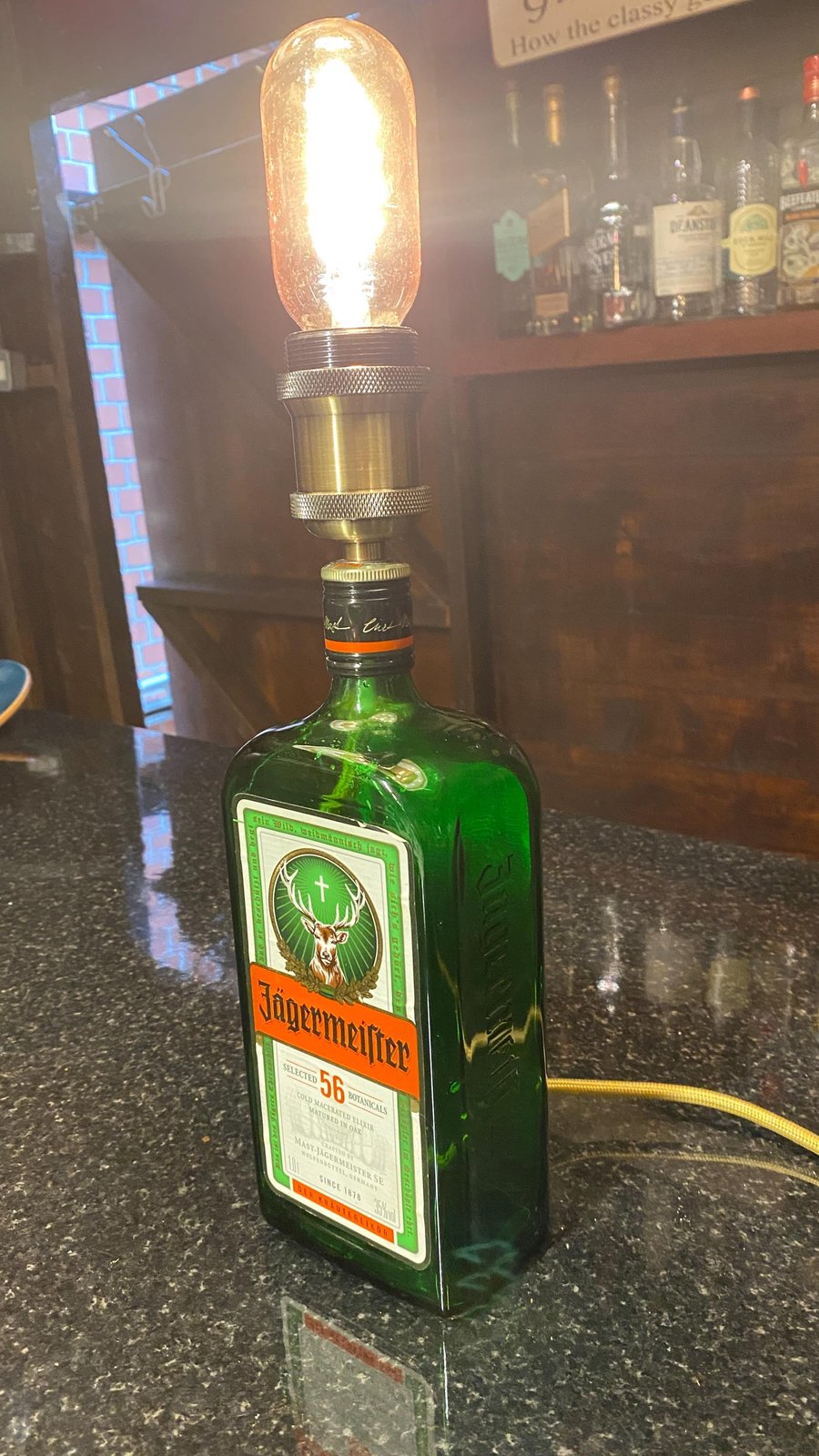 Up cycled spirit bottle table lamp