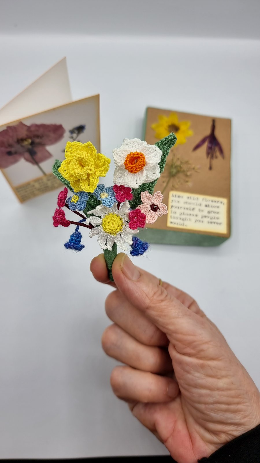 a spring flower brooch. with daffodil , narcisus , forgetme nots , daisy 