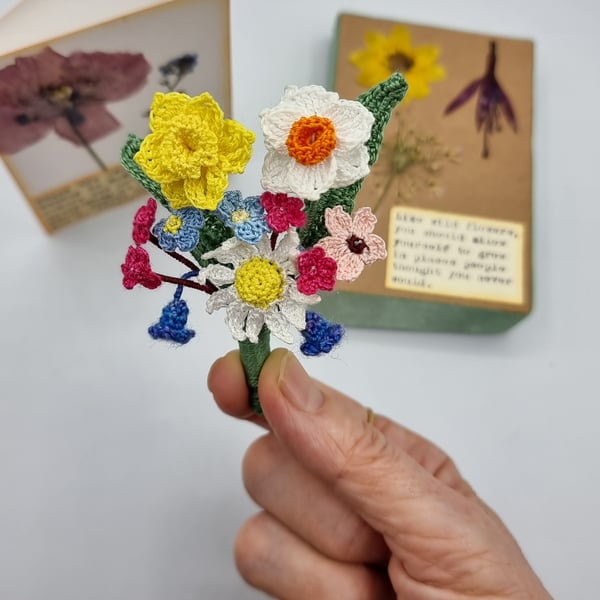 a spring flower brooch. with daffodil , narcisus , forgetme nots , daisy 