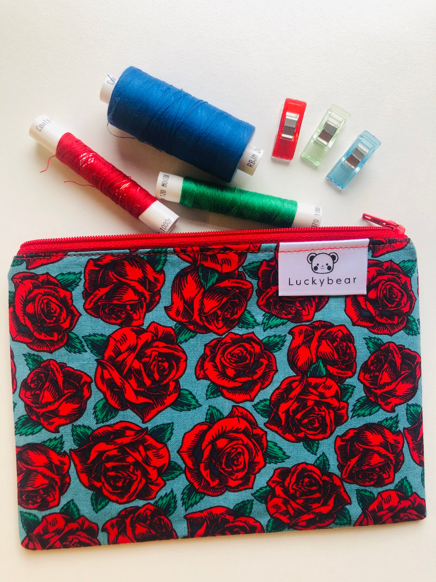 Fifties-style rose print zip pouch, bold floral zip pouch in red rose print