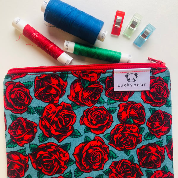 Fifties-style rose print zip pouch, bold floral zip pouch in red rose print