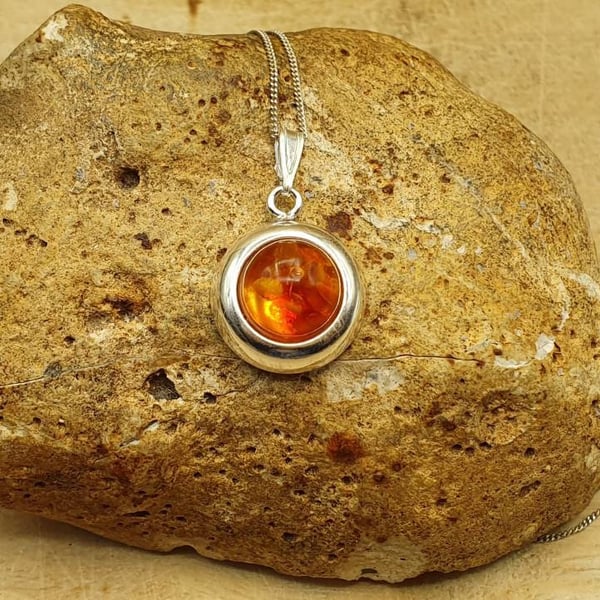 Small round amber pendant necklace. Simple minimalist jewellery. Reiki Charged.