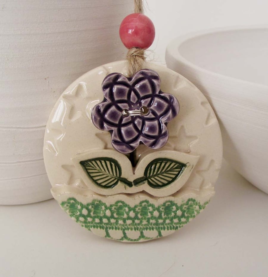 Ceramic decoration with flower button