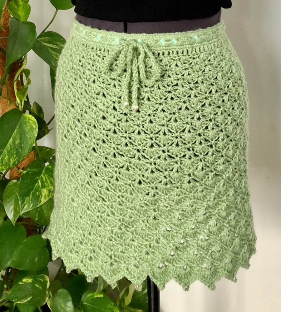Sage green crochet skirt with beads. Size 8.