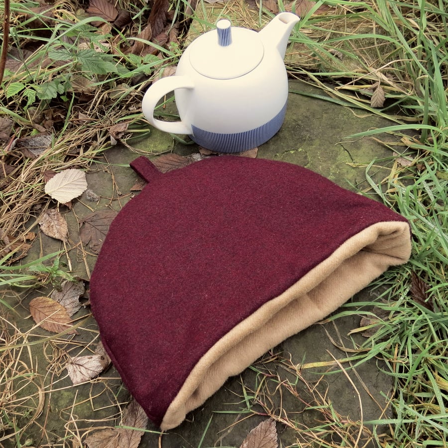 A tea cosy, size large.  Made from a tactile aubergine wool. 