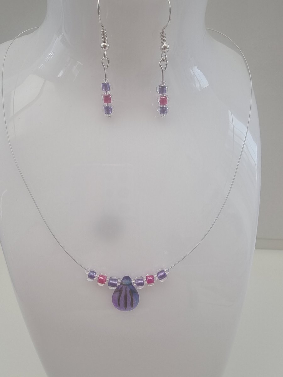 Blue and purple engraved pip bead set