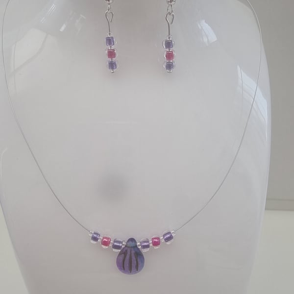 Blue and purple engraved pip bead set