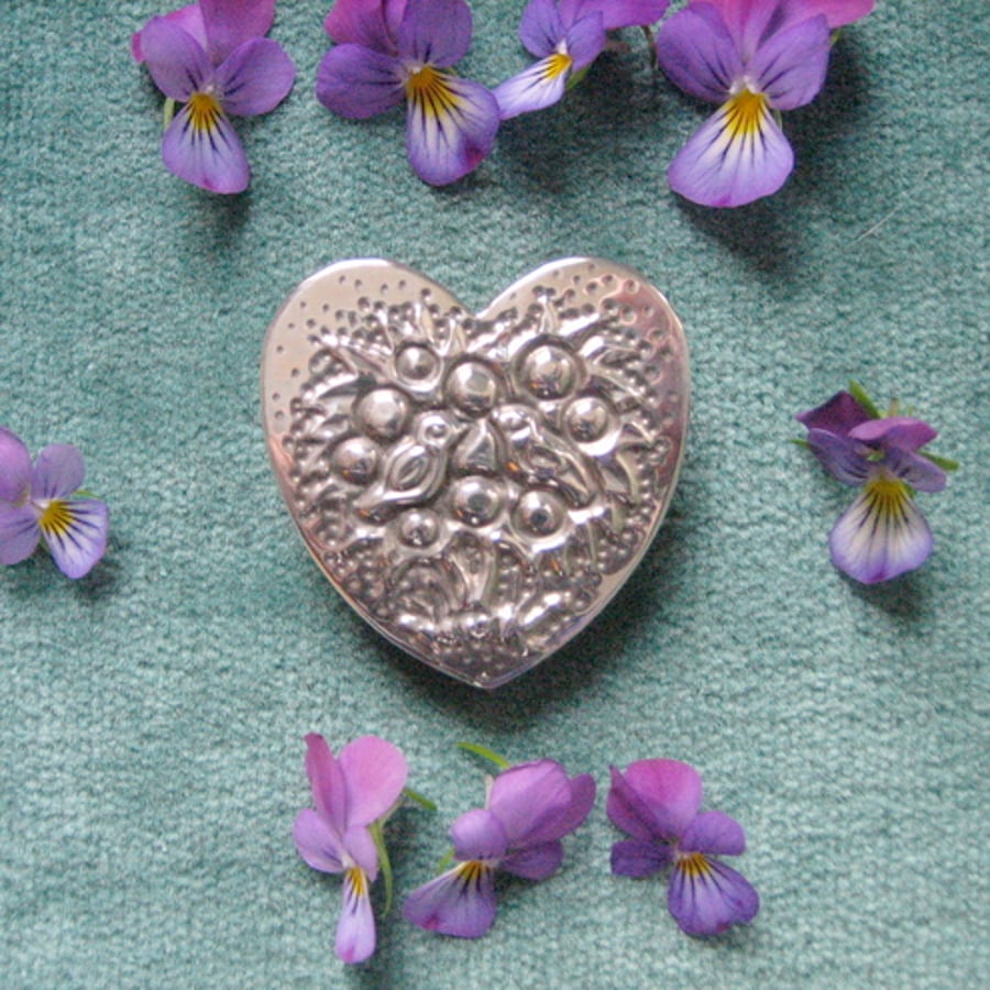 Heart-shaped bird brooch
