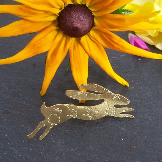 Hare brooch in brass with imprinted flower design
