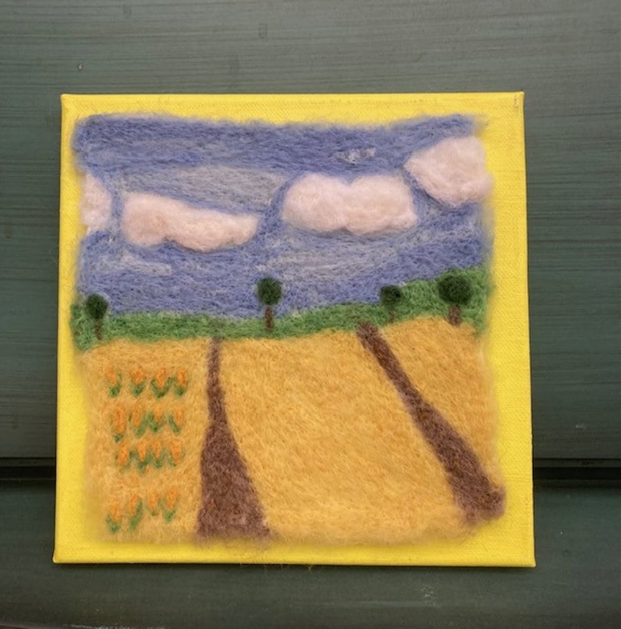 Country fields felted picture.