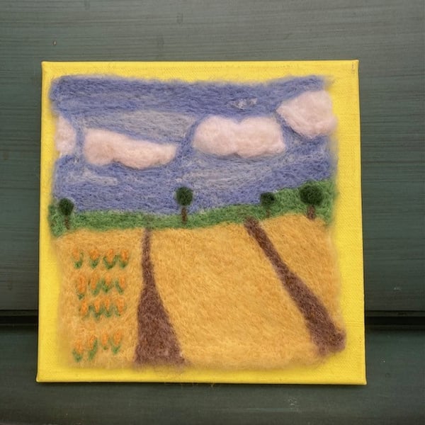 Country fields felted picture.