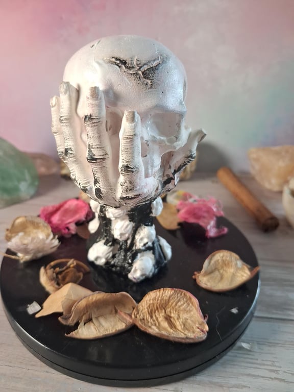 Hand painted Stonecast Skull in Hand