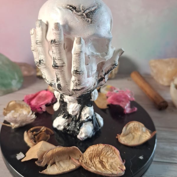 Hand painted Stonecast Skull in Hand