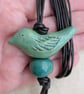 Green ceramic bird pendant on dark brown leather cord - Image 4