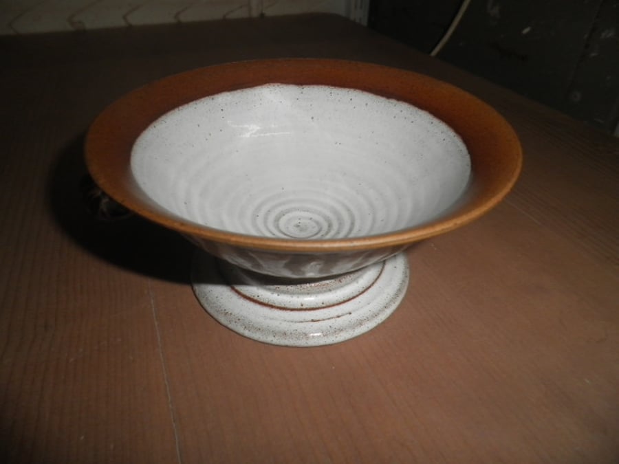 Wheel thrown Stoneware toasted clay with Tin white glaze decoration animal print