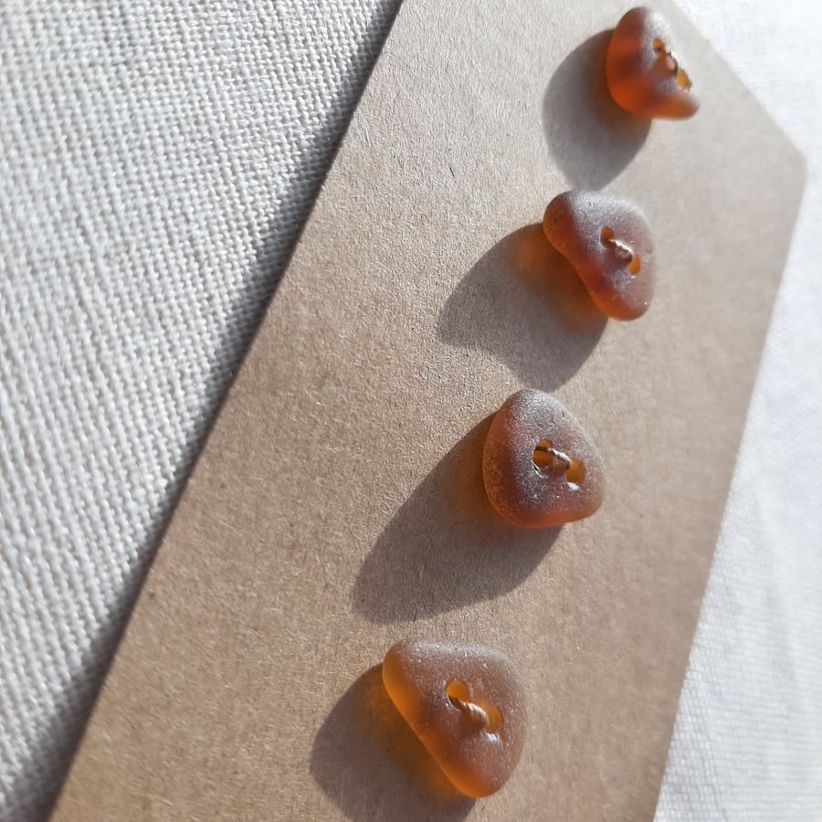 Set of four brown sea glass buttons