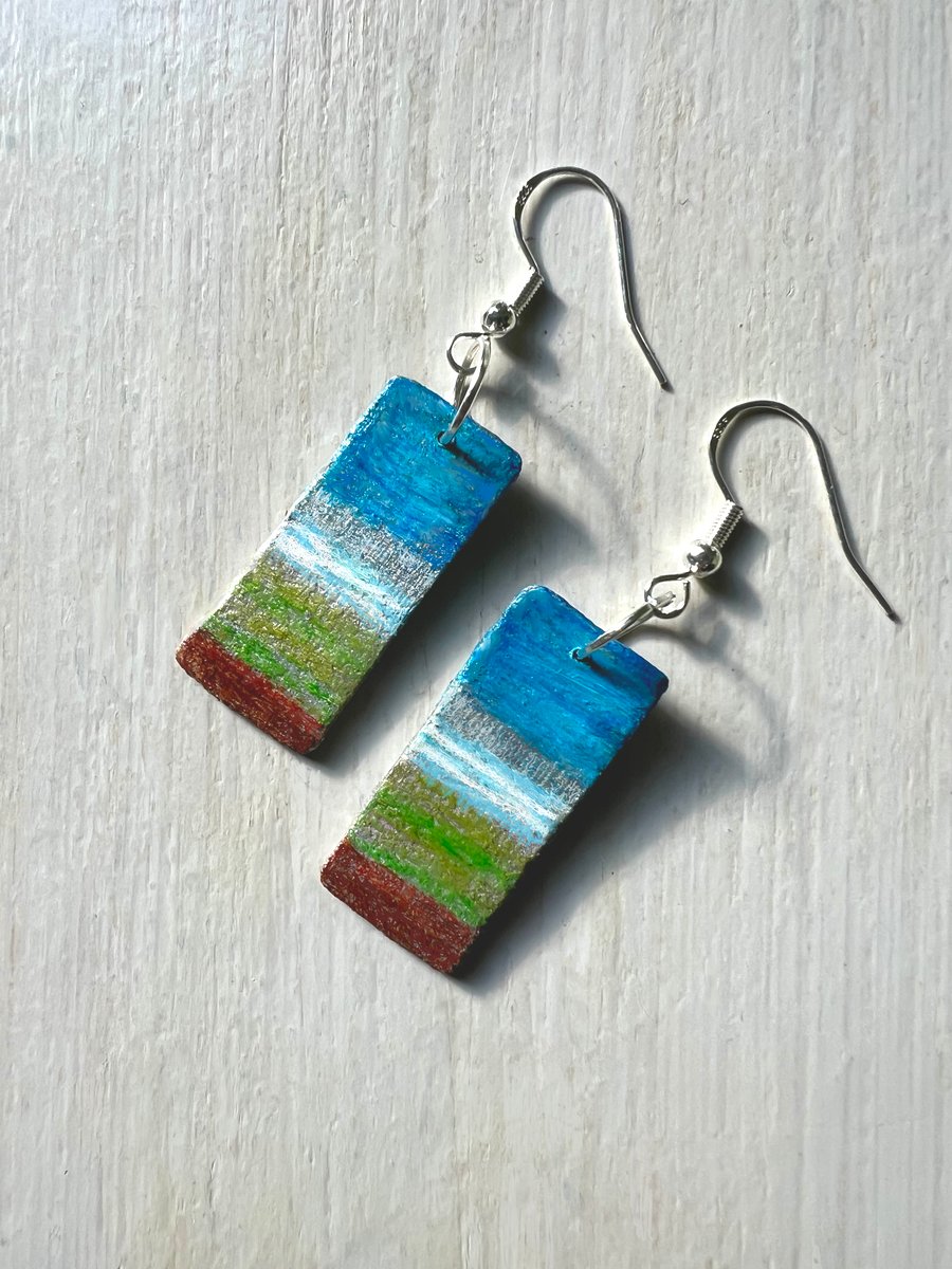 Little landscapes, painted wood on silver-plated earrings.