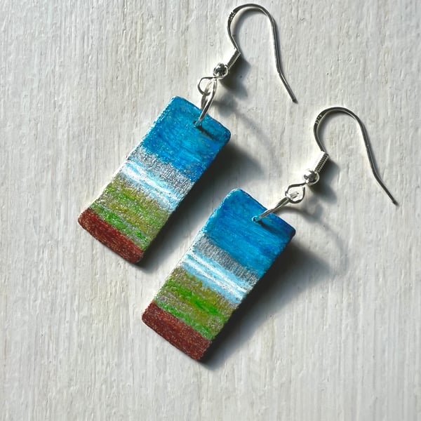 Little landscapes, painted wood on silver-plated earrings.