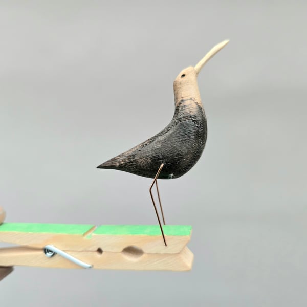 Pecking peg bird