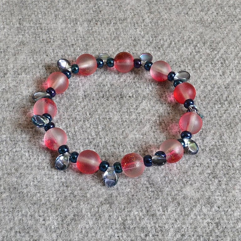 Frosted-Red-Gold Glass Bead Elastic Bracelet with Blue Seed and Pip Bead Accents