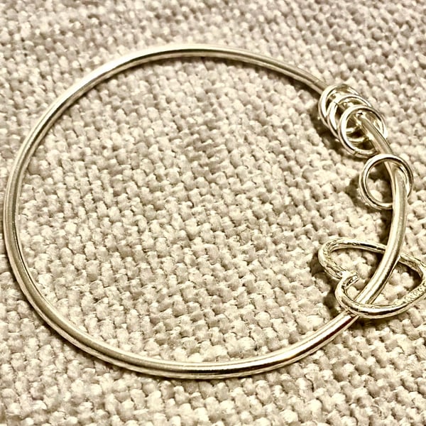 Heart charm and rings  on a heavy weight silver bangle