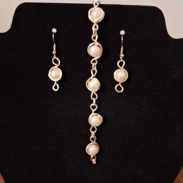 Silver wire wrapped pearl bracelet and matching earrings