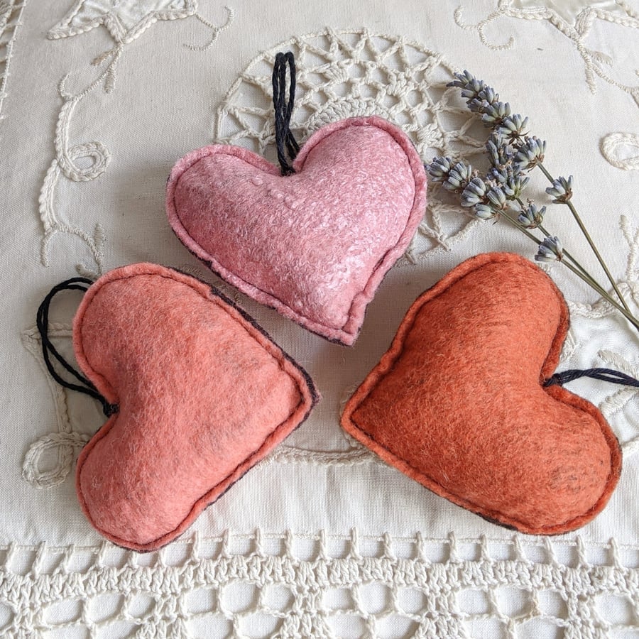 Three lavender hearts in shades of peach