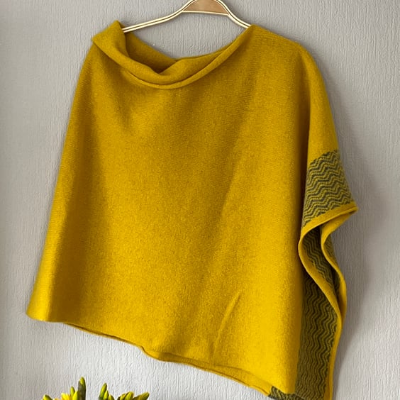Soft merino lambswool piccalilli yellow poncho with wavy uniform grey border