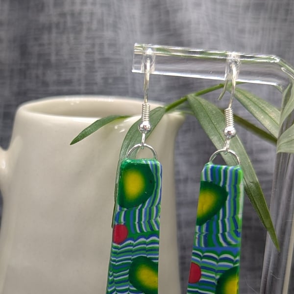 Long teal green earrings.