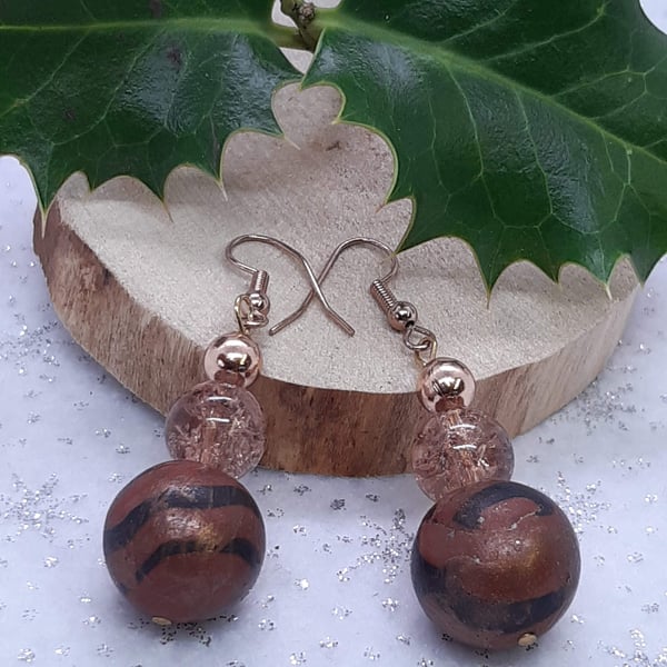 Conker brown and black dangly earrings with a bronze sheen