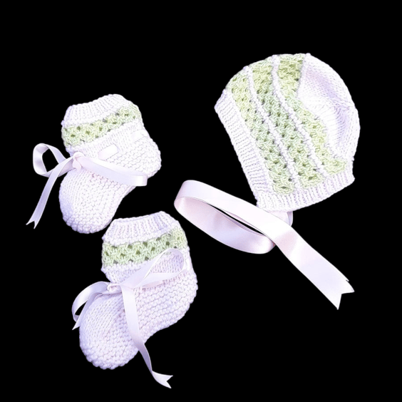 Hand knitted pink and green baby bonnet and booties and set 