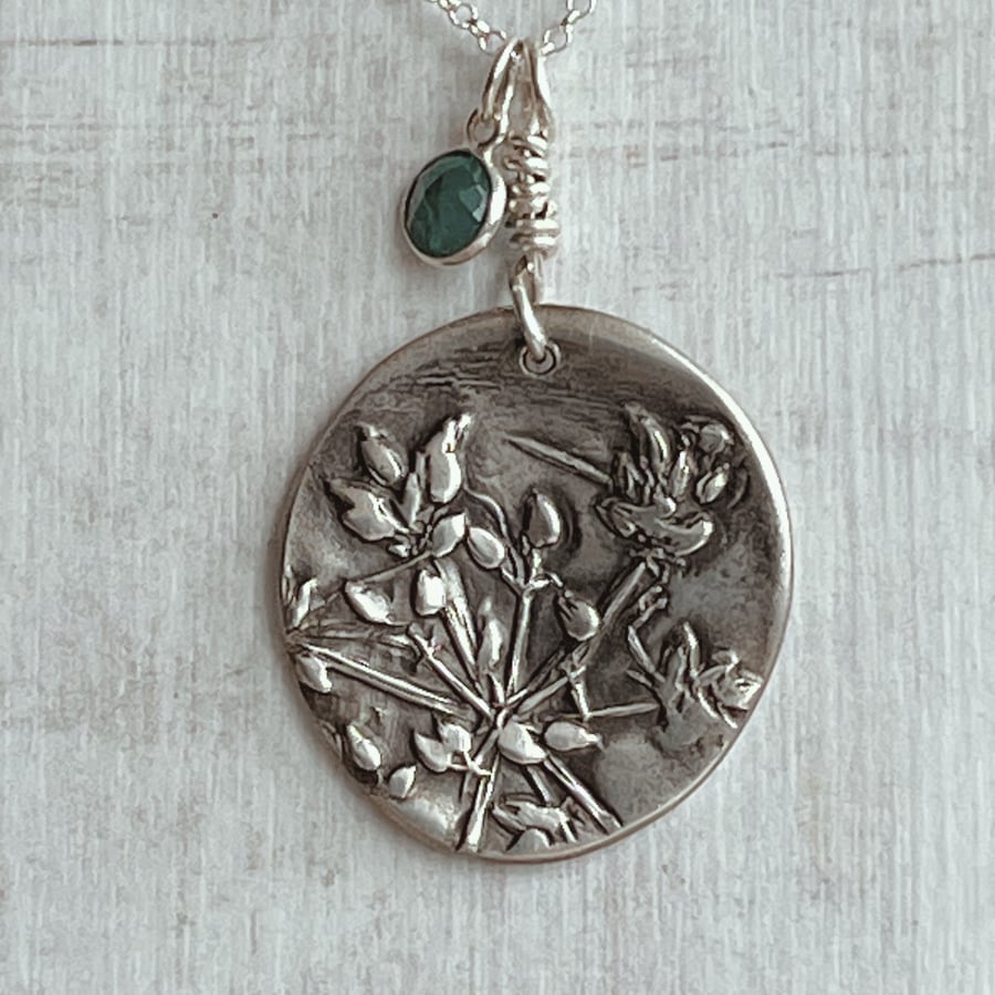 Botanical  sterling silver pendant with emerald charm.