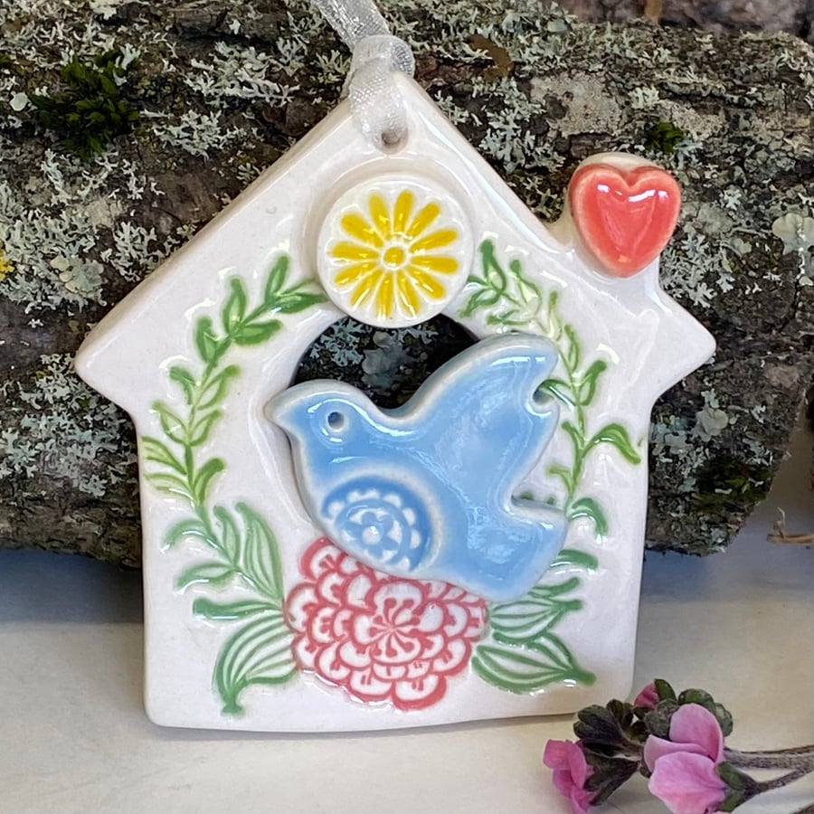 Small Ceramic bird house decoration with flying bird