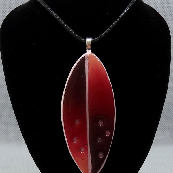 Dark red cut out pendant 