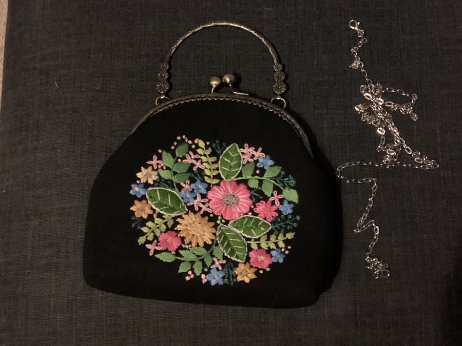 Black embroidered floral clasp bag.  