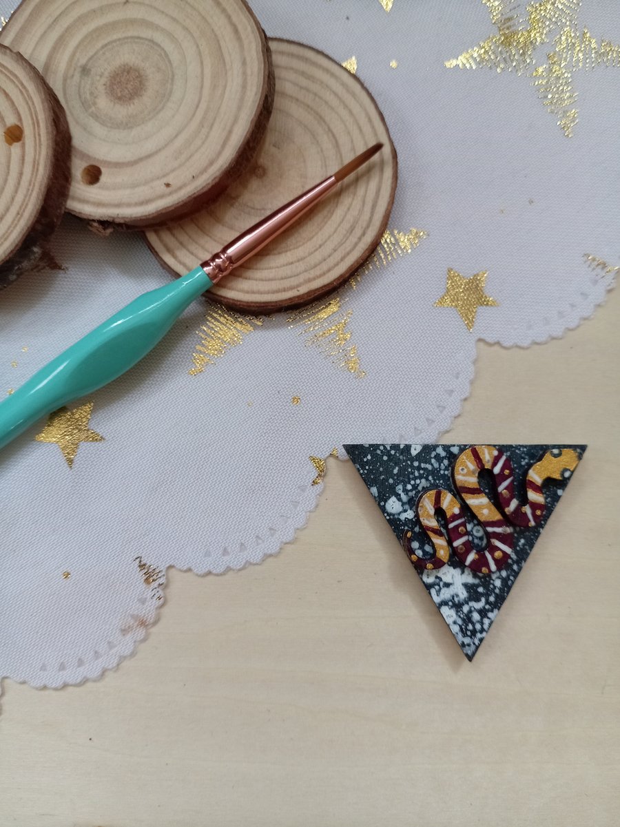 Wooden triangular shaped snake fridge magnet 