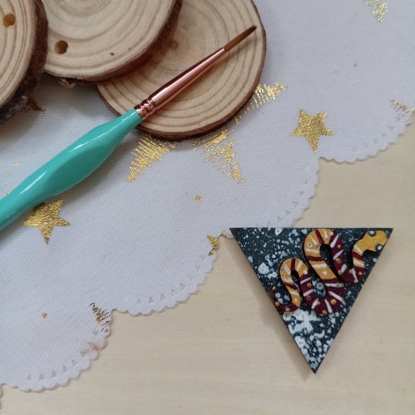 Wooden triangular shaped snake fridge magnet 