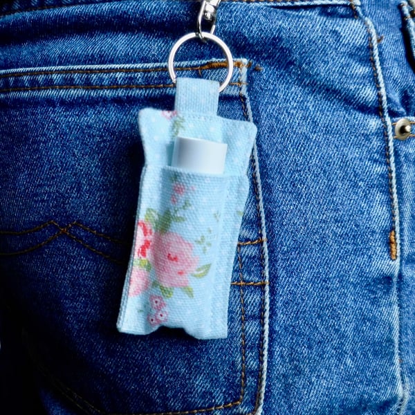 Key ring lip balm holder in blue and pink floral print