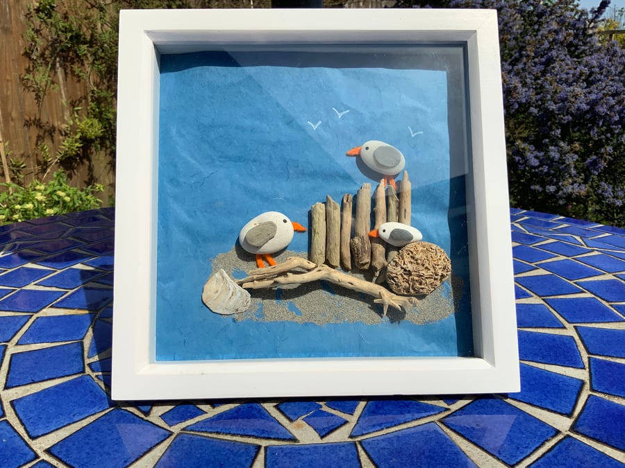 Pebble Art Seagulls. A fun pebble and driftwood picture. Three seagulls.