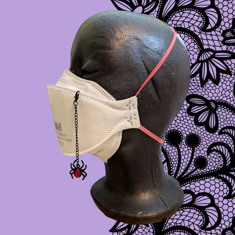 Dangling spider charm