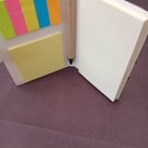 Handbag sized notepad with writing pad, sticky notes and colourful index pads.