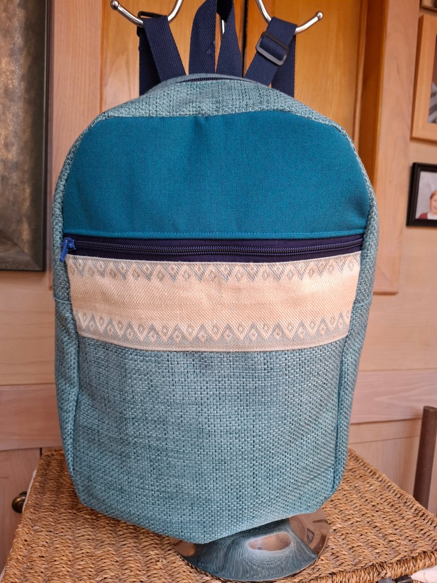 Light blue and brocade backpack