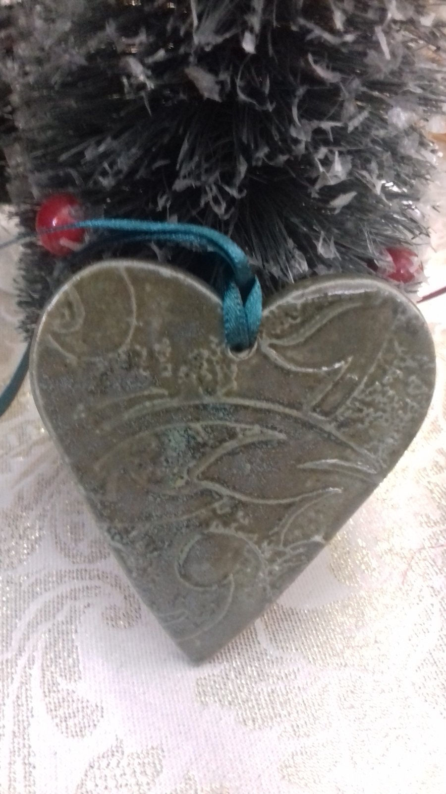 Handmade ceramic green heart hanging decoration 
