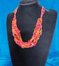 Crocheted necklace in shades of red and gold, lightweight - Image 1